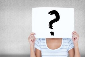 woman-with-sign-face-with-question-mark